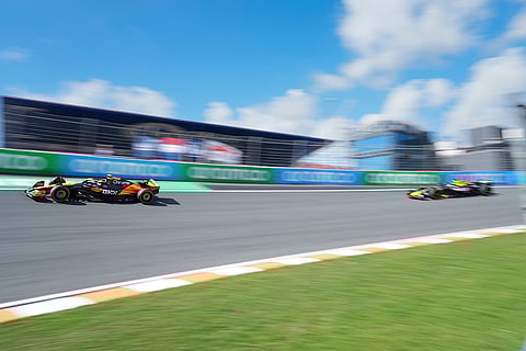 Dutch Grand Prix 2024: McLaren driver Lando Norris of Britain, left, steers his car in front of Red Bull driver Max Verstappen of the Netherlands